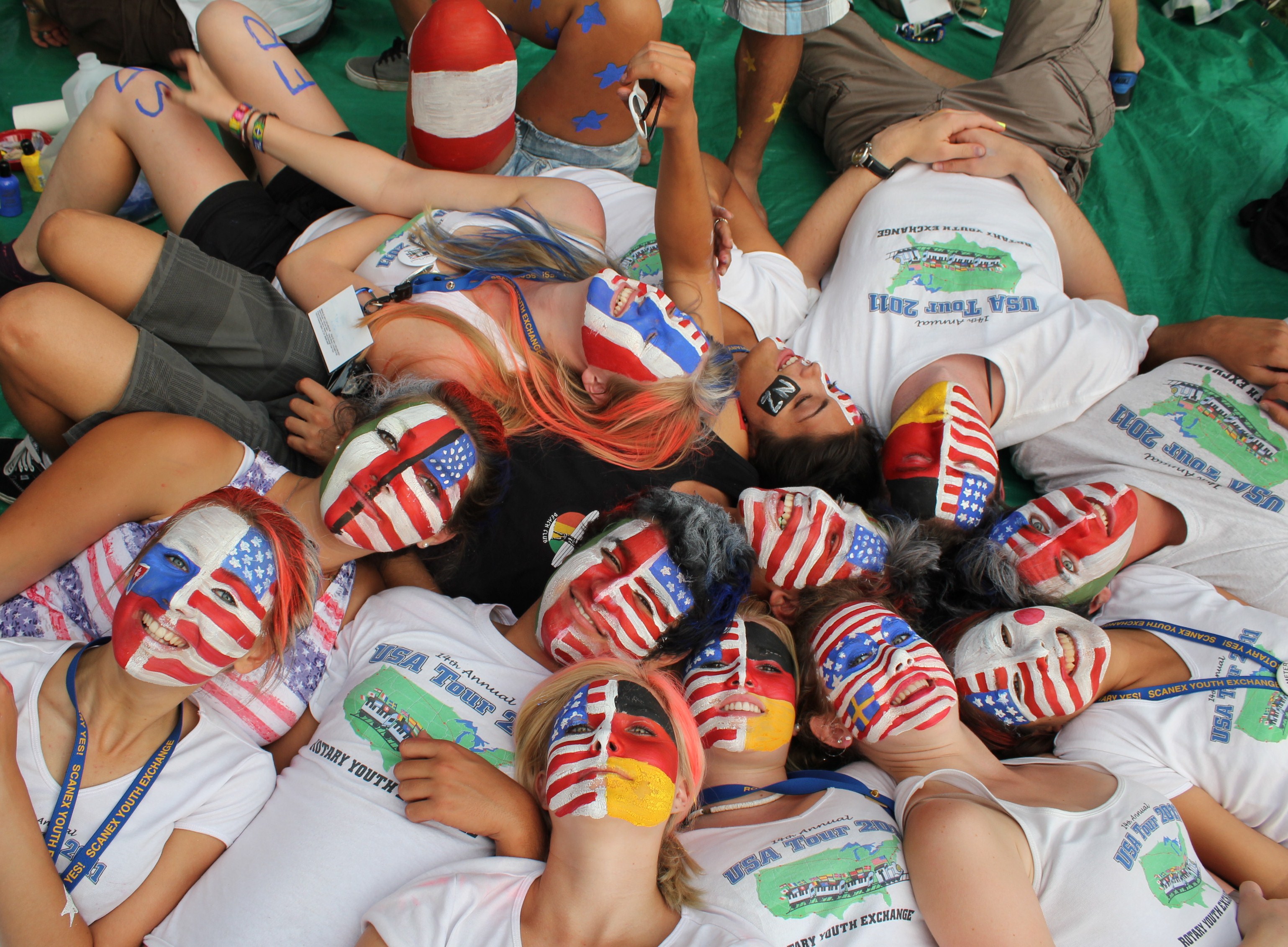 Students with face paint of the US and their home country.